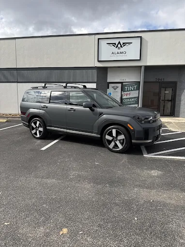 Gray Hyundai Santa Fe with carbon window film parked outside Alamo Auto Aesthetics in San Antonio, TX